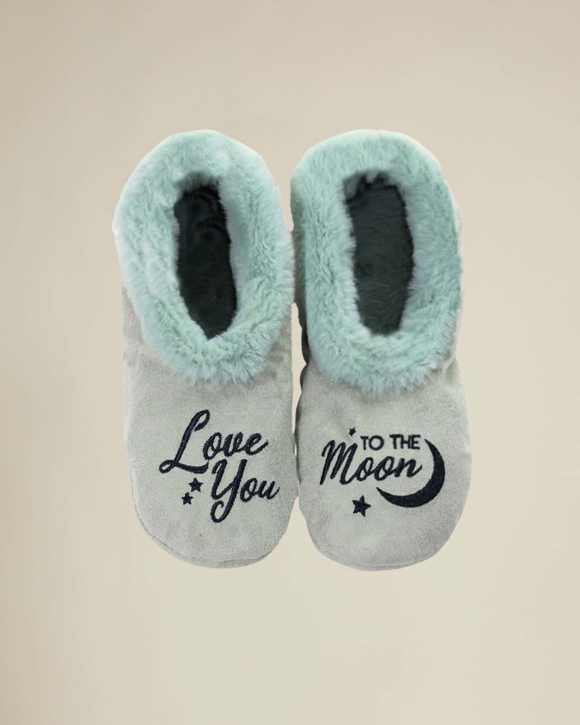 A pair of teal-colored slippers with the phrase 'Love You to the Moon' printed on the top.