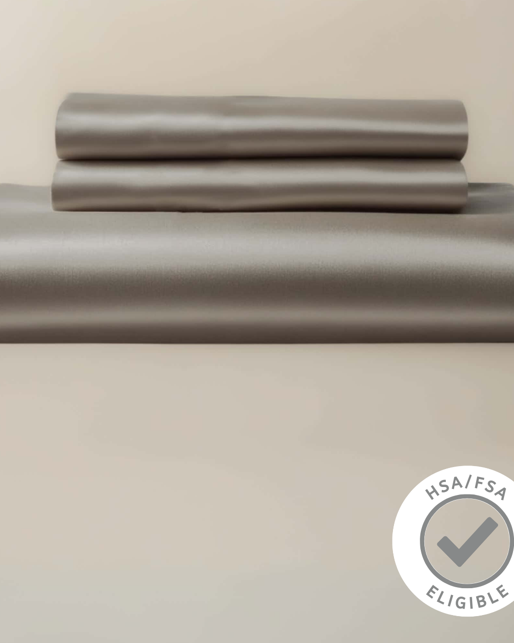 Gray bed sheet set on a beige background with a HSA FSA eligibility badge