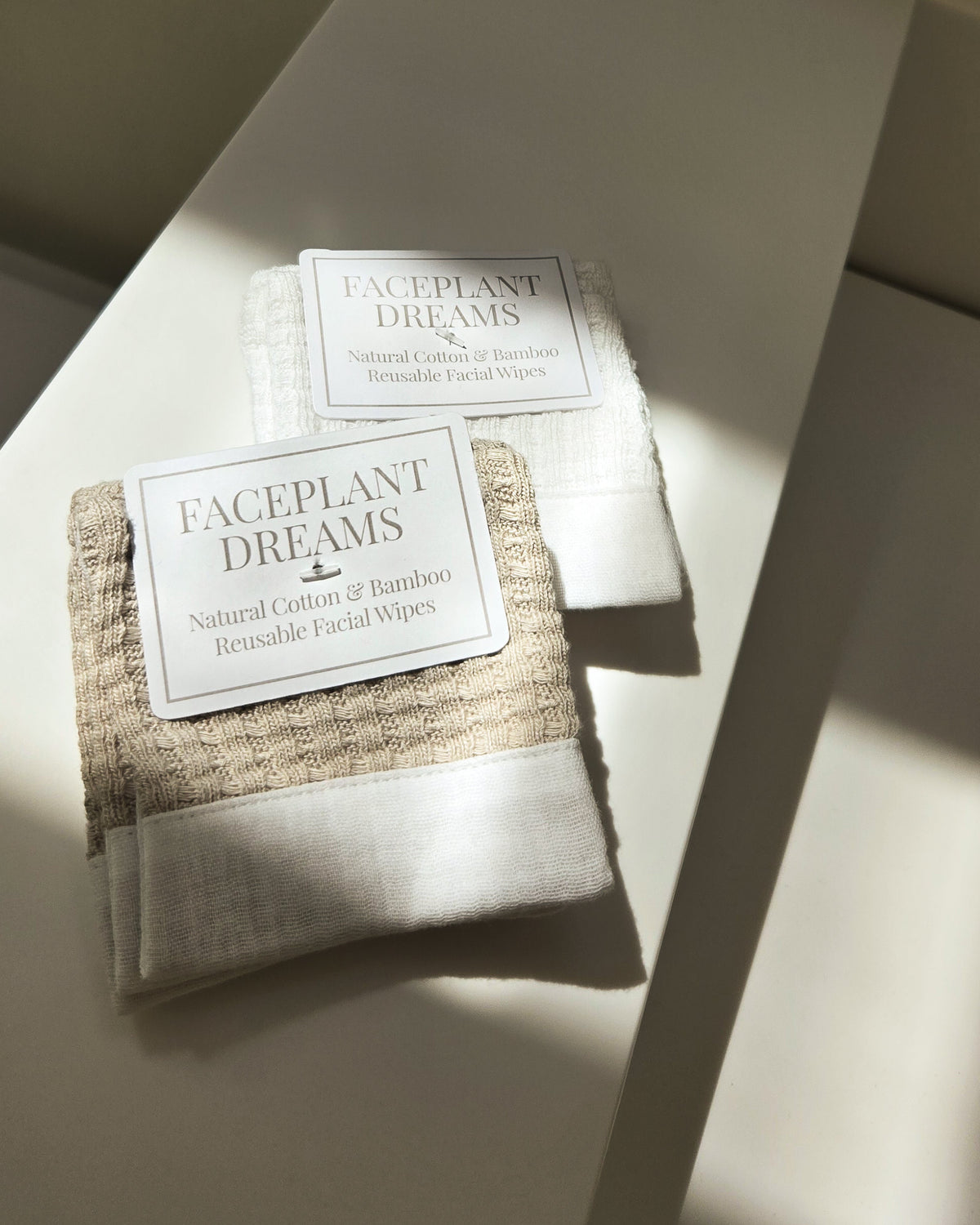 Faceplant Dreams facial wipes in packaging on a light surface with soft shadows