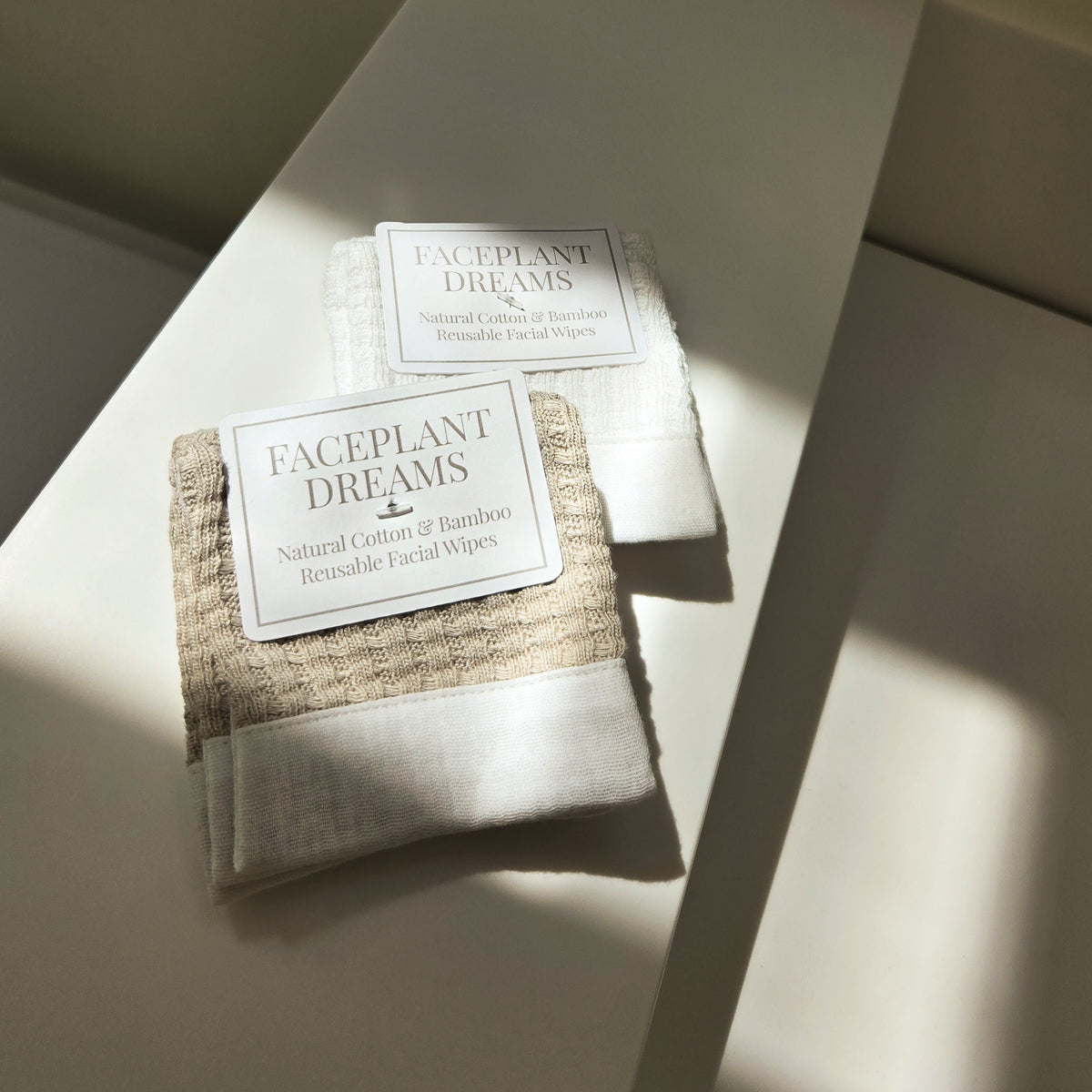 Faceplant Dreams facial wipes in packaging on a light surface with soft shadows