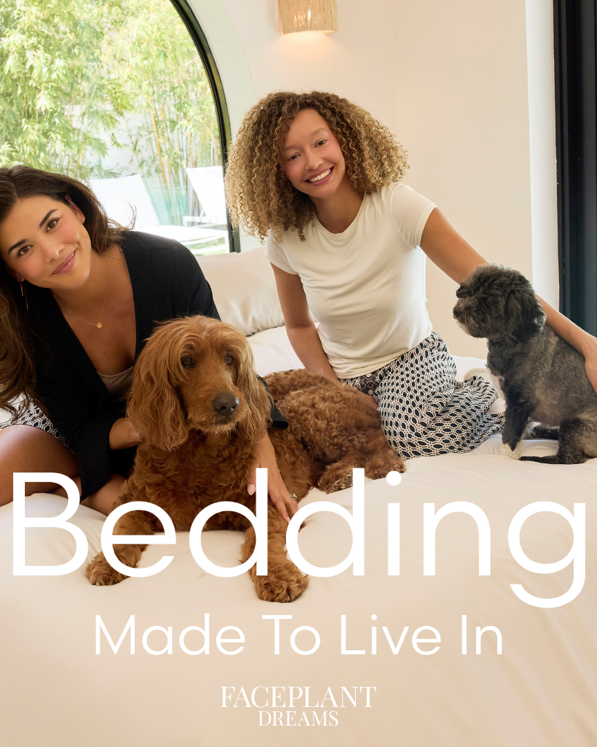 Women sitting on soft Faceplant bedding with dogs.