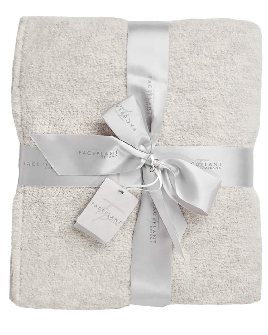 Plush throw blanket adds warmth to your bed or couch.