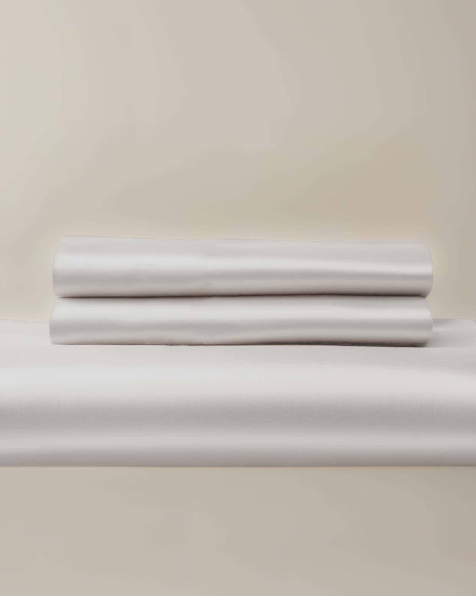 A white bamboo duvet cover and pillow shams set, neatly presented on a light background.