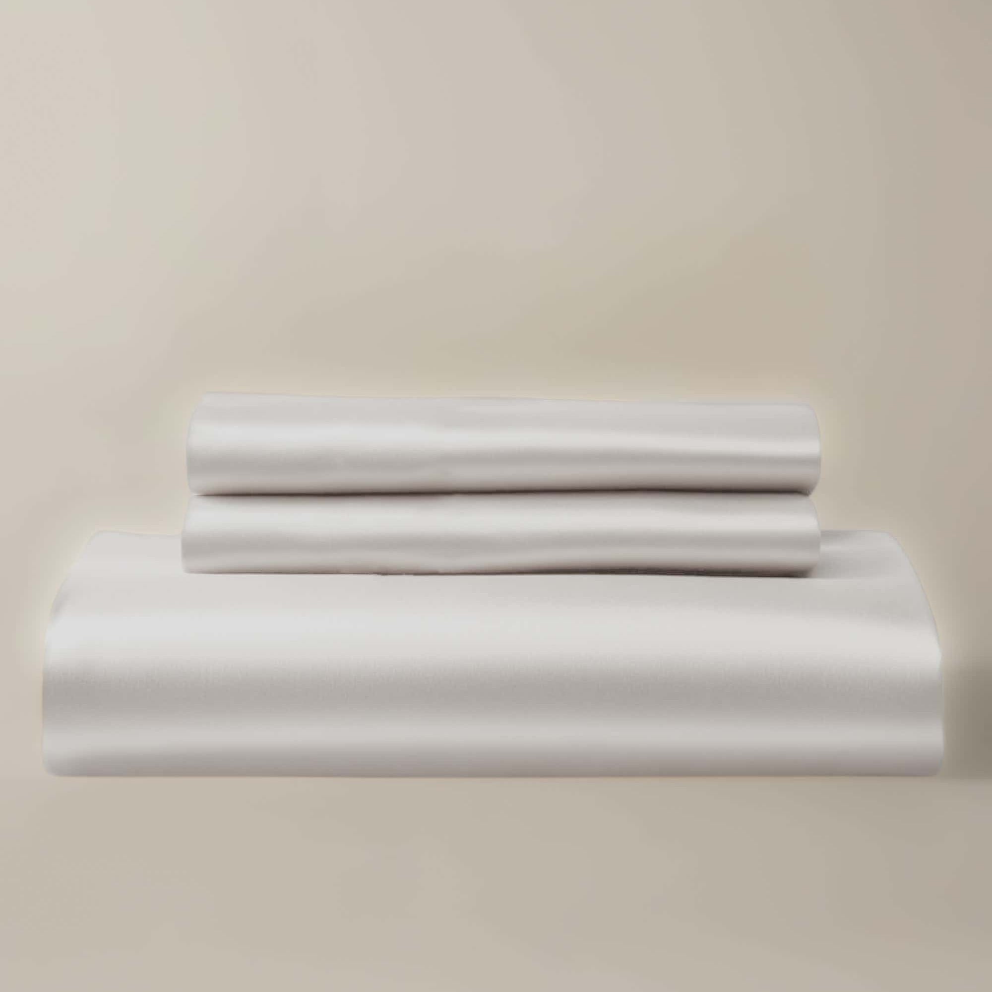A white bamboo duvet cover and pillow shams set, neatly presented on a light background.