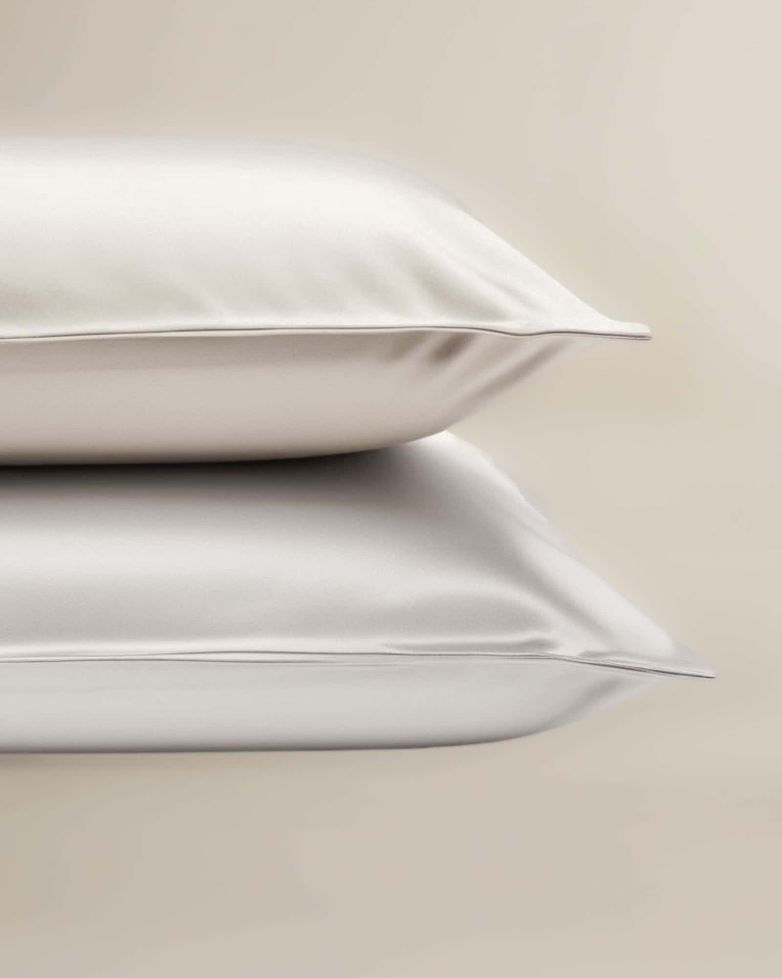 A set of White bamboo pillowcases neatly stacked on top of each other.