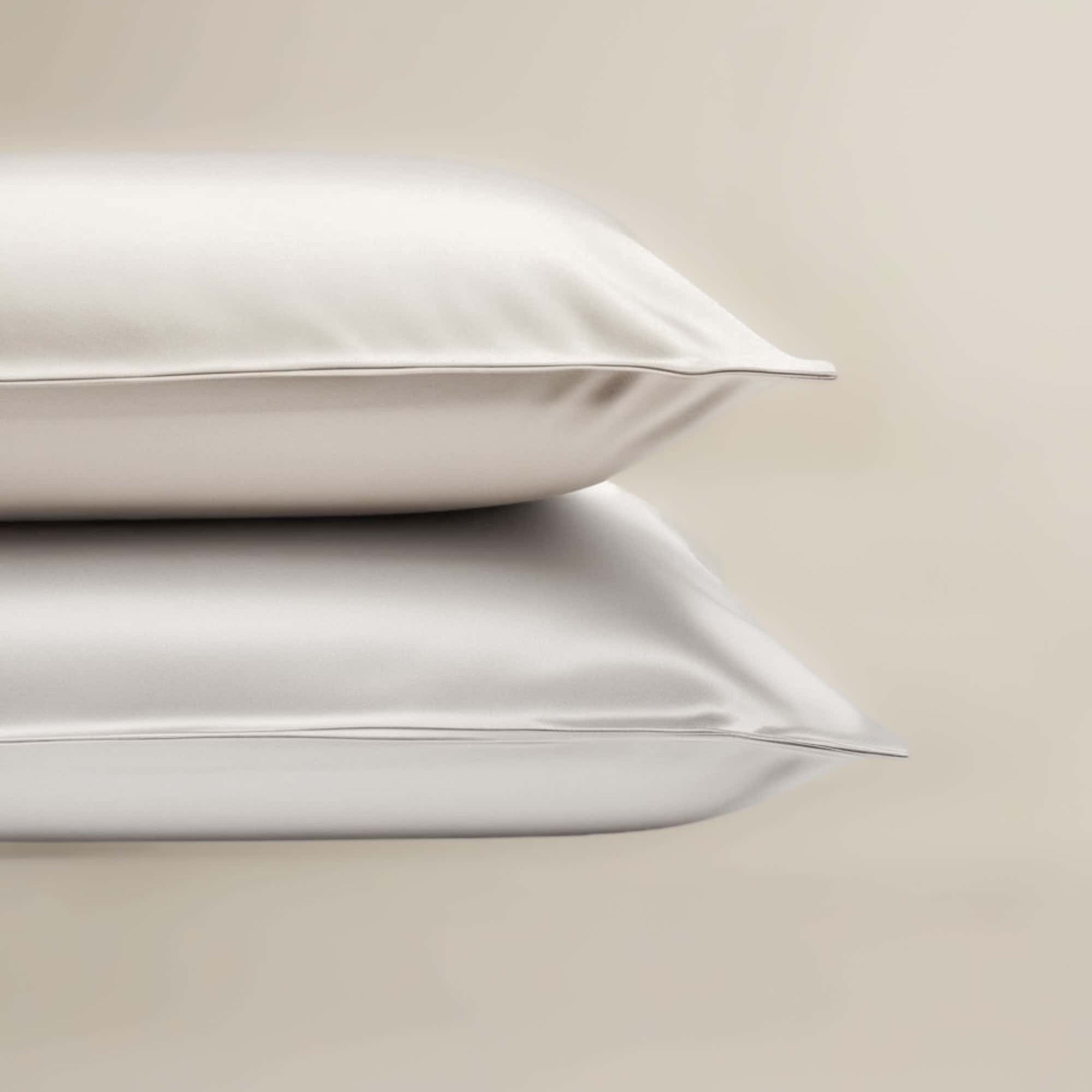 A set of White bamboo pillowcases neatly stacked on top of each other.