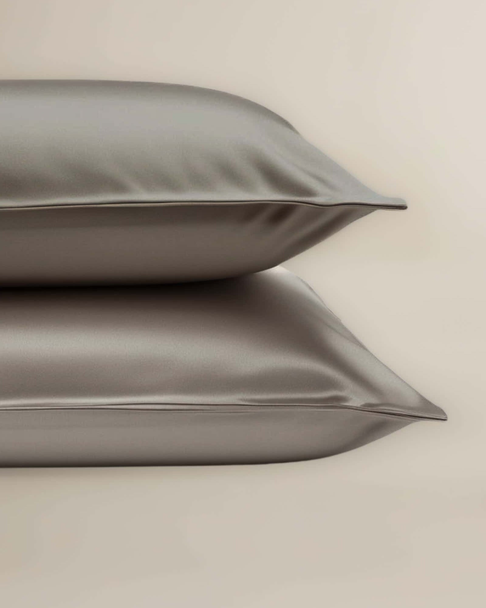 A set of Grey bamboo pillowcases neatly stacked on top of each other.
