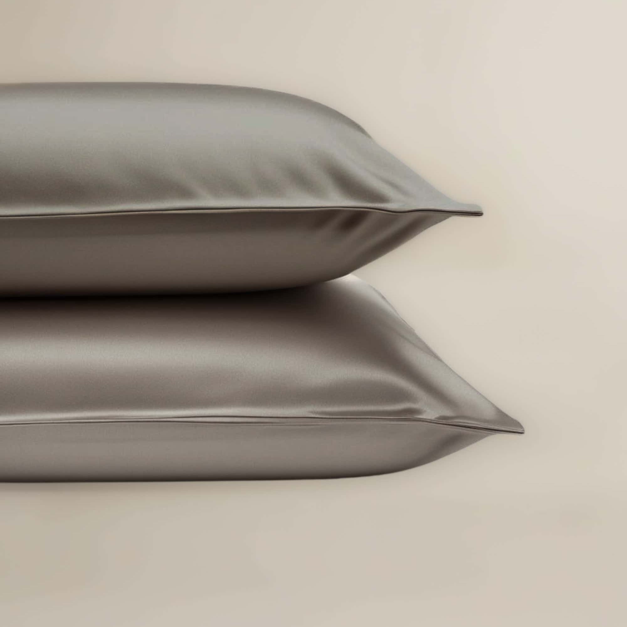 A set of Grey bamboo pillowcases neatly stacked on top of each other.