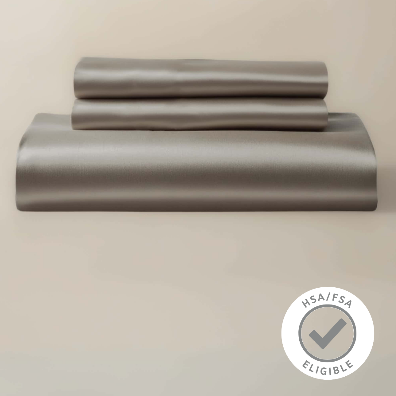 Gray bed sheet set on a beige background with a HSA FSA eligibility badge