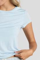 Light blue shirt worn by a person on a plain background
