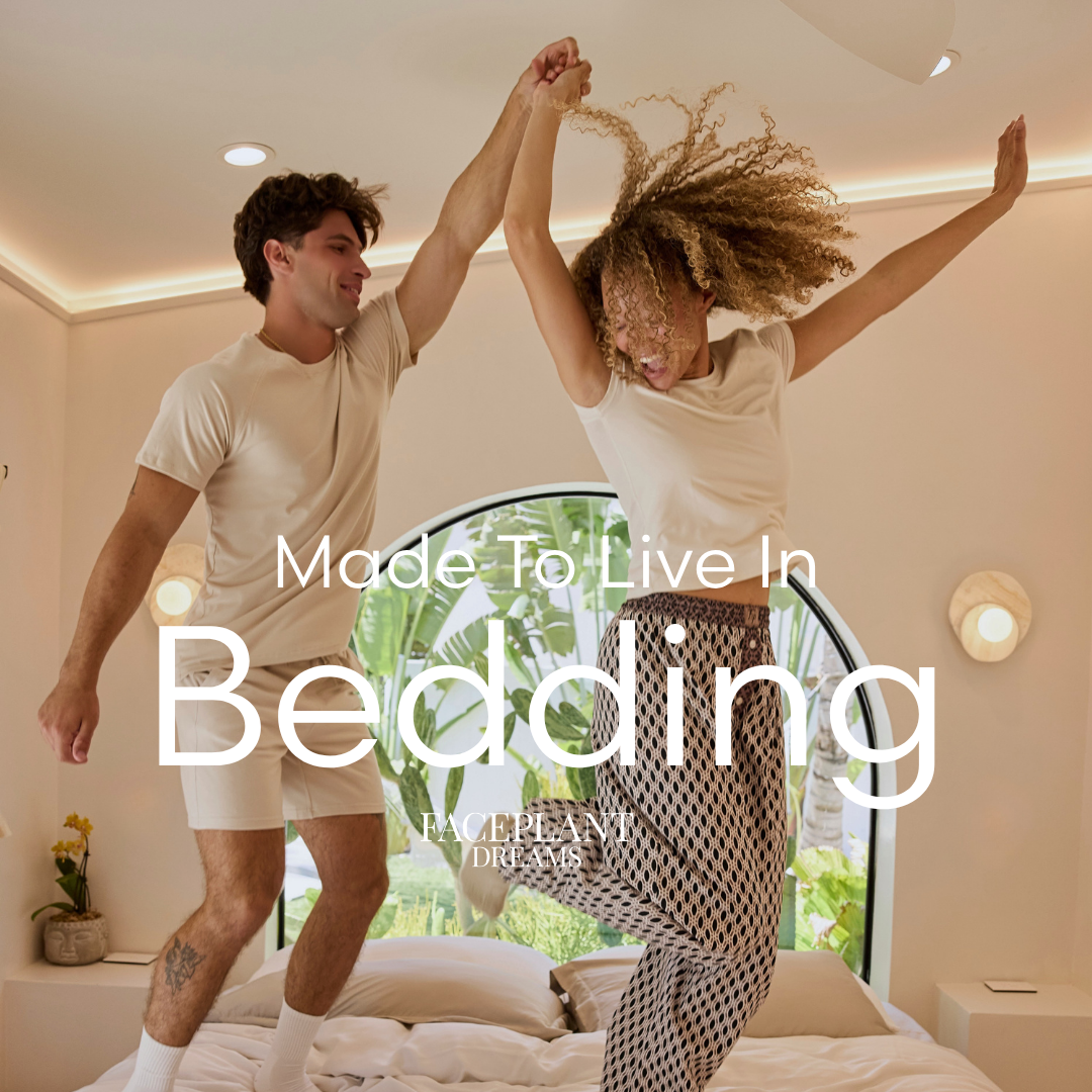 Two people jumping on a bed with 'Made To Live In Bedding' text overlay.