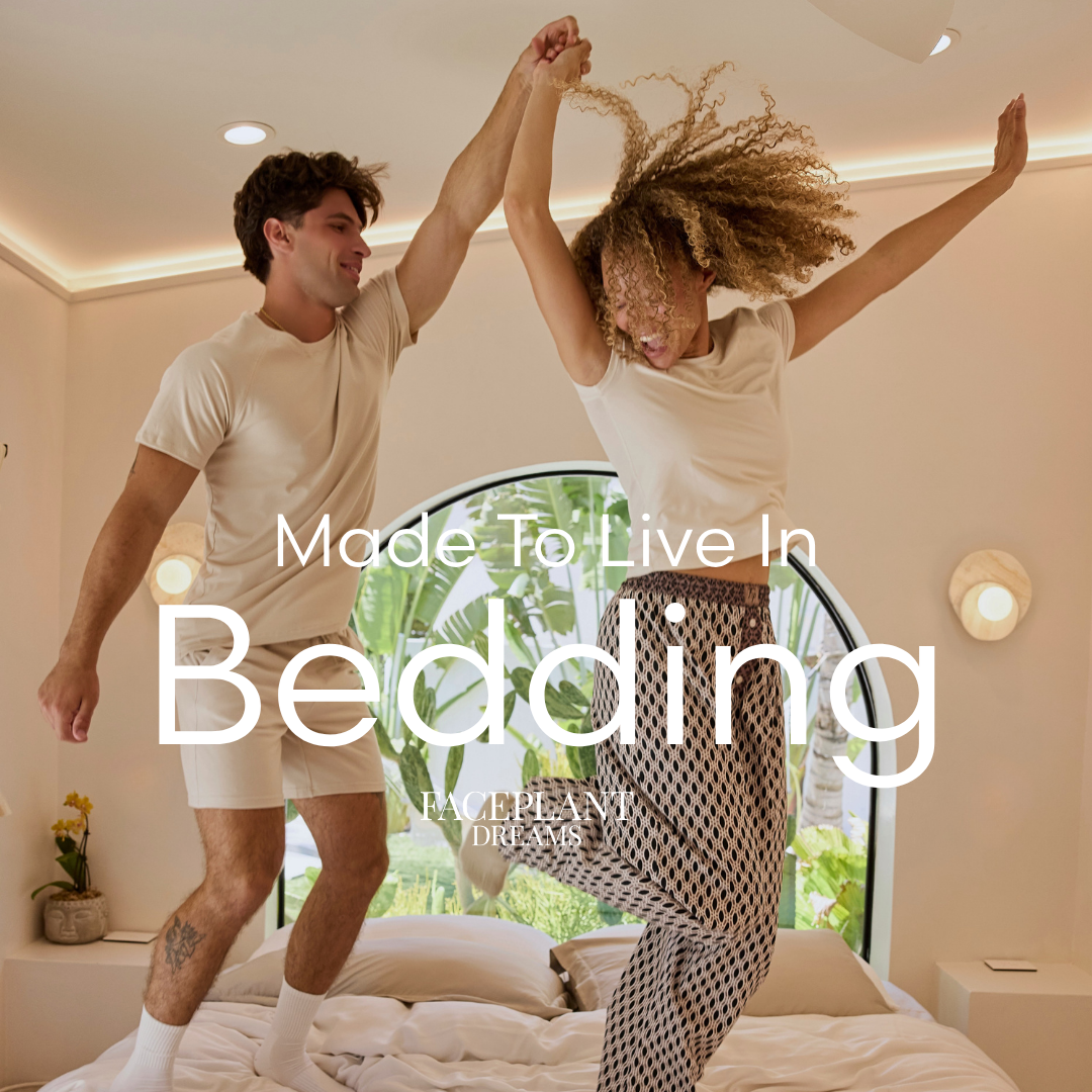 Two people jumping on a bed with 'Made To Live In Bedding' text overlay.