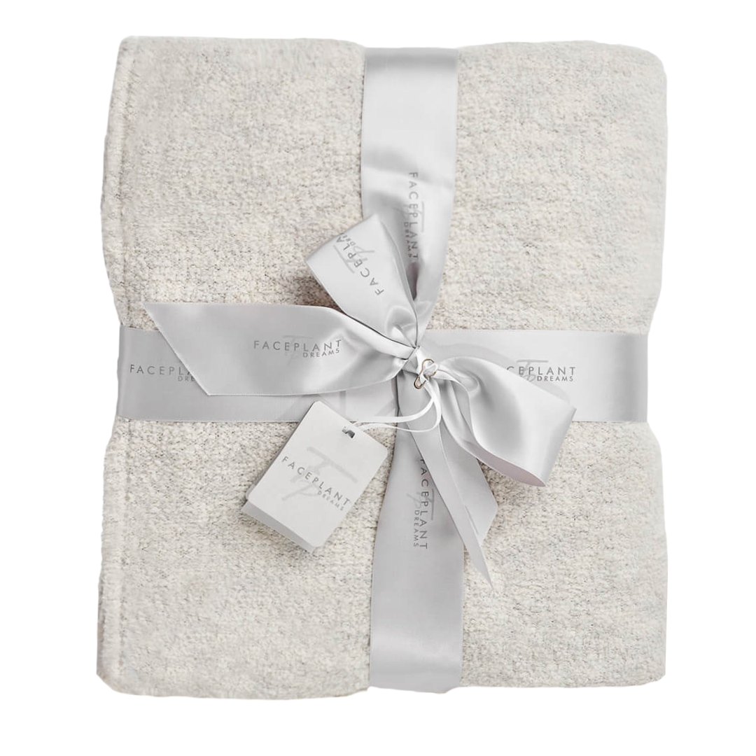 Plush throw blanket adds warmth to your bed or couch.